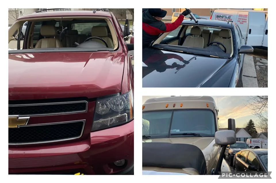 A technician cleaning the windshield of a red SUV.