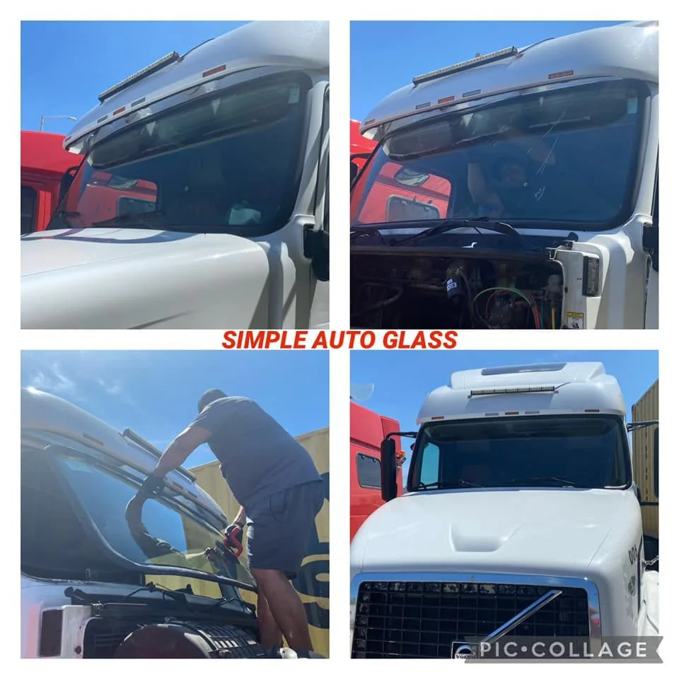 A technician installing a windshield on a white work truck.